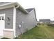 Exterior of a home with gray siding, brick accents, and well-kept lawn at 1274 Clairet, Westfield, IN 46074