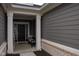 Inviting front porch with classic columns and a charming bench seating, enhances the home's entry at 1274 Clairet, Westfield, IN 46074