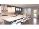 Bright kitchen featuring a center island, stainless steel range hood, and adjacent dining area at 1274 Clairet, Westfield, IN 46074