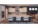 Modern kitchen with white cabinets, stainless steel appliances, and a large center island with seating at 1274 Clairet, Westfield, IN 46074