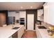 Spacious kitchen with stainless steel appliances, white cabinets, and a large island for meal prep at 1274 Clairet, Westfield, IN 46074