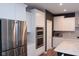 A kitchen featuring white cabinets, stainless steel appliances, and an island with a stone countertop at 1274 Clairet, Westfield, IN 46074