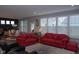 A living room with sofas, chairs, and a view into a dining room and windows with white shutters at 1274 Clairet, Westfield, IN 46074
