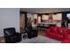 A living room featuring sofas, chairs, and an open view to the modern kitchen at 1274 Clairet, Westfield, IN 46074