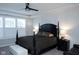 Main bedroom with a large bed, ceiling fan, and bright windows fitted with plantation shutters at 1274 Clairet, Westfield, IN 46074