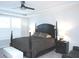 Elegant main bedroom featuring tray ceilings, a four-poster bed, and modern nightstands at 1274 Clairet, Westfield, IN 46074