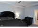 Main bedroom featuring a large bed with decorative pillows and a black leather lounge chair at 1274 Clairet, Westfield, IN 46074