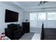 Main bedroom view features a TV, dressers, and bright windows fitted with plantation shutters at 1274 Clairet, Westfield, IN 46074