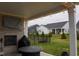 Covered patio with an outdoor fireplace, tv, and view of the backyard and fence at 1274 Clairet, Westfield, IN 46074