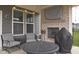 Outdoor patio with a brick fireplace, seating, and string lights, perfect for entertaining at 1274 Clairet, Westfield, IN 46074