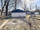 View of backyard and detached two-car garage at 1425 N Lasalle St, Indianapolis, IN 46201
