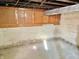Spacious unfinished basement featuring shelving and concrete walls at 1425 N Lasalle St, Indianapolis, IN 46201