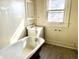 Bathroom features a clawfoot tub and a window with natural light at 1425 N Lasalle St, Indianapolis, IN 46201
