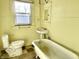 Bathroom featuring natural light and a claw foot tub at 1425 N Lasalle St, Indianapolis, IN 46201