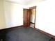 Bedroom with an open door showcasing space and potential at 1425 N Lasalle St, Indianapolis, IN 46201