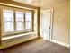 Bright bedroom featuring a window seat and neutral carpet at 1425 N Lasalle St, Indianapolis, IN 46201