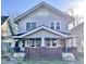 Charming two-story home with a brick porch and inviting curb appeal at 1425 N Lasalle St, Indianapolis, IN 46201