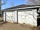 Exterior view of detached two car garage with peeling paint at 1425 N Lasalle St, Indianapolis, IN 46201