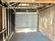 Interior of detached garage showing framing and garage door at 1425 N Lasalle St, Indianapolis, IN 46201