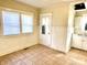 Kitchen area with a window and door offering natural light and access at 1425 N Lasalle St, Indianapolis, IN 46201