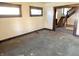 Spacious living room featuring large windows and staircase to the upper level at 1425 N Lasalle St, Indianapolis, IN 46201