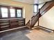 Charming living room with staircase and built-in shelving for storage at 1425 N Lasalle St, Indianapolis, IN 46201