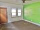 Empty living room with a ceiling fan, and multiple windows with plenty of natural light at 1425 N Lasalle St, Indianapolis, IN 46201