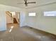 Spacious living room with neutral walls and staircase in view at 1425 N Lasalle St, Indianapolis, IN 46201