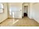 Empty room with wall paneling and a view to another room at 1425 N Lasalle St, Indianapolis, IN 46201