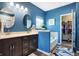 Beautiful bathroom with double sinks, a soaking tub, and stylish blue walls at 1684 Beach St, Greenwood, IN 46143