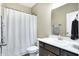 Compact bathroom featuring a shower with curtain, vanity and neutral walls at 1684 Beach St, Greenwood, IN 46143