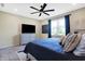 Bright bedroom with a large window, dresser with a television, and a comfortable bed at 1684 Beach St, Greenwood, IN 46143