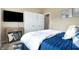 Comfortable bedroom with TV, side table, and large closet for ample storage space at 1684 Beach St, Greenwood, IN 46143