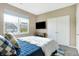 Well lit bedroom featuring a plush bed, neutral walls, and a large window at 1684 Beach St, Greenwood, IN 46143