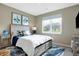 Cozy bedroom featuring a comfortable bed with storage drawers and a large window at 1684 Beach St, Greenwood, IN 46143