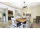A dining room with modern light fixture and an adjacent coffee and wine bar at 1684 Beach St, Greenwood, IN 46143