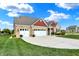 A beautiful home with manicured lawn and landscaping, and a three-car garage at 1684 Beach St, Greenwood, IN 46143