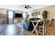 Spacious living room features a ceiling fan, mounted TV, stylish furniture, and wood flooring at 1684 Beach St, Greenwood, IN 46143