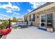 Spacious outdoor patio with comfortable seating, fire pit and beautiful brick accents at 1684 Beach St, Greenwood, IN 46143
