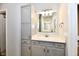 Bathroom featuring vanity with storage, drawers, white countertop, a sink, and a mirror at 1803 Jackson St, Fortville, IN 46040