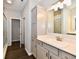Bathroom featuring vanity with storage, drawers, white countertop, a sink, and a mirror at 1803 Jackson St, Fortville, IN 46040