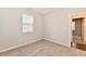 Neutral bedroom featuring carpeted floors and a view into the hallway at 1803 Jackson St, Fortville, IN 46040