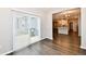 Bright dining area with sliding glass doors and dark, modern flooring, next to the kitchen at 1803 Jackson St, Fortville, IN 46040