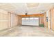 Unfinished garage featuring concrete floors and visible wall studs at 1803 Jackson St, Fortville, IN 46040