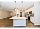 Modern kitchen with white cabinets, quartz countertops and stainless steel appliances at 1803 Jackson St, Fortville, IN 46040