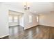This bright and airy living room features dark wood flooring and recessed lighting at 1803 Jackson St, Fortville, IN 46040
