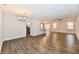 Bright open-concept living room features recessed lighting, fan, and view into kitchen at 1803 Jackson St, Fortville, IN 46040