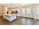 Open concept living room featuring recessed lights and kitchen view with stainless steel appliances at 1803 Jackson St, Fortville, IN 46040