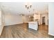 Open concept living room features a modern kitchen, recessed lighting and dark wood flooring at 1803 Jackson St, Fortville, IN 46040