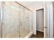 Shower featuring glass enclosure, a window, tile walls, and a showerhead at 1803 Jackson St, Fortville, IN 46040